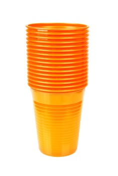 Stack of orange plastic cups isolated on white background