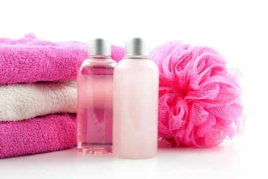 pink spa bathroom accessory on cane mat over white background