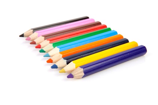 colorful pencils in a row isolated on white background