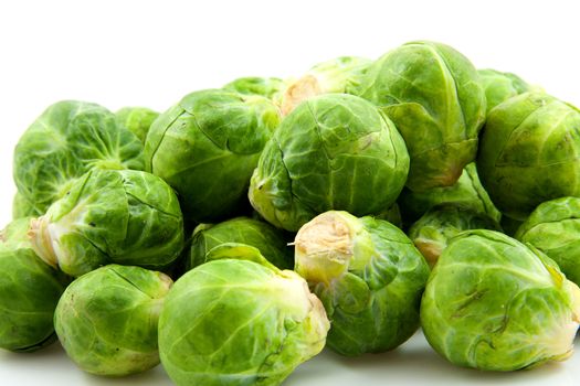  Brussels sprouts in closeup over white background