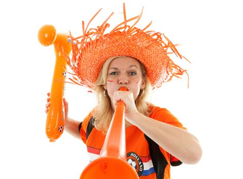 Female Dutch soccer supporter with orange plastic vuvuzela and blown up hammer over white background