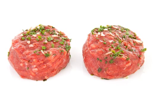two raw German beef steak isolated on white background