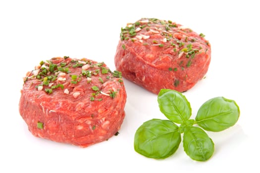 two raw German beef steak isolated on white background