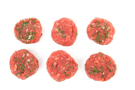 six raw German beef steak isolated on white background