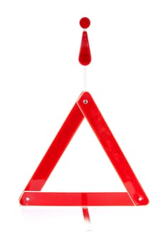 Foldaway reflective road hazard warning triangle isolated on a white background
