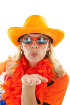 Female Dutch soccer supporter in orange outfit gives a hand kiss over white background