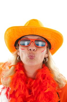 Female Dutch soccer supporter in orange outfit gives a kiss over white background