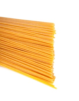 bundle of raw spaghetti over white background