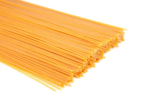 bundle of raw spaghetti over white background