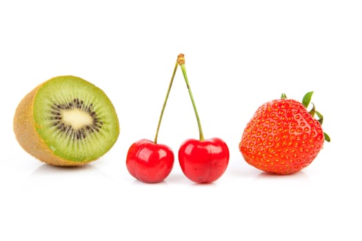 fresh fruits with strawberry, cherries and kiwi over white background