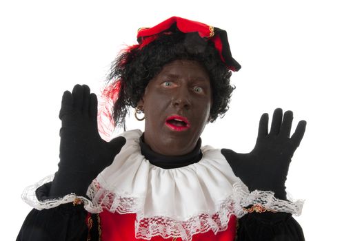 surprised Zwarte piet ( black pete) typical Dutch character part of a traditional event celebrating the birthday of  Sinterklaas in december over white background