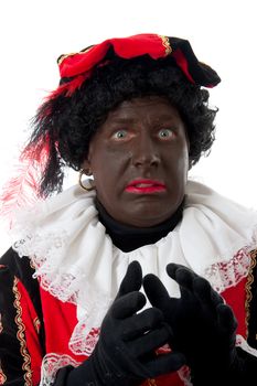 scared Zwarte piet ( black pete) typical Dutch character part of a traditional event celebrating the birthday of  Sinterklaas in december over white background