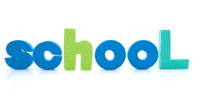 Word school in colorful foam letters over white background