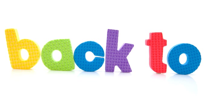 Words "back to" in colorful foam letters over white background