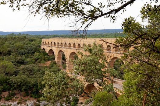 Scenic view of Roman built Pont du Gard aqueduct, Vers-Pont-du-Gard in South of France.
