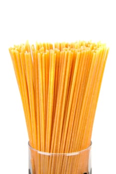 bundle of raw spaghetti over white background