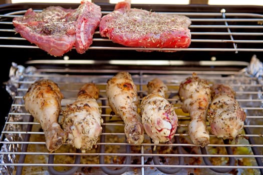 Meat and chicken on barbecue