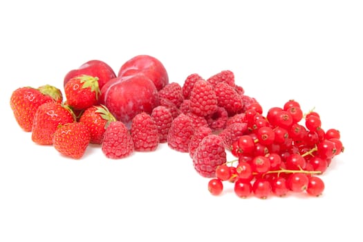Fresh red fruits isolated on white background. raspberries, strawberries and plums