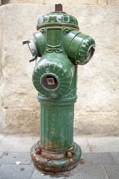 Old green fire hydrant in closeup