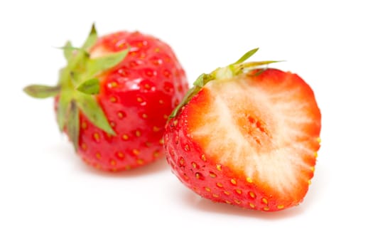 fresh strawberries in closeup isolated on white background