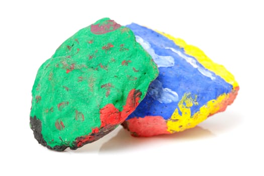 colorful stones painted by children isolated over white background