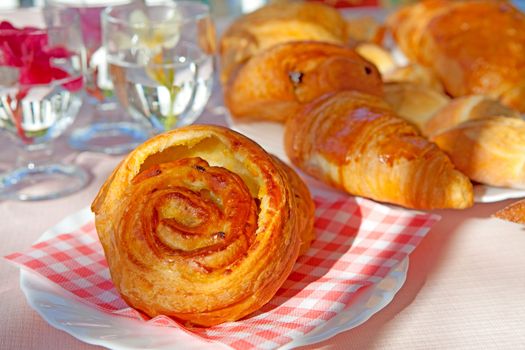 delicious french bread on checkered napkin and plate in closeup