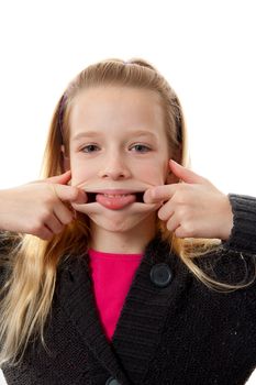 Girl is making funny face, she sticks her tongue out over white background