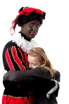 girl is hugging black pete ( typical Dutch event in december with character zwarte piet) over white background