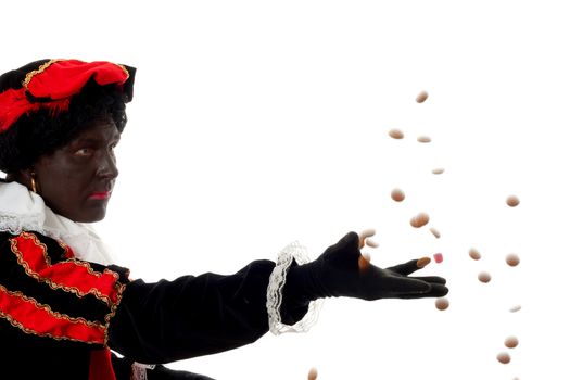 Zwarte piet ( black pete) typical Dutch character part of a traditional event celebrating the birthday of Sinterklaas in december over white background throwing pepernoten ( ginger nuts) 