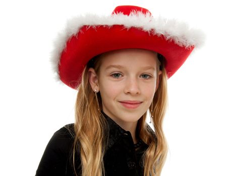 Girl with christmas hat is posing over white background