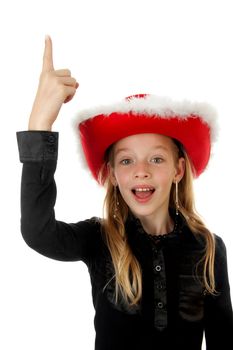 blonde girl with christmas hat over white background is pointing above her head to empty space for your text 