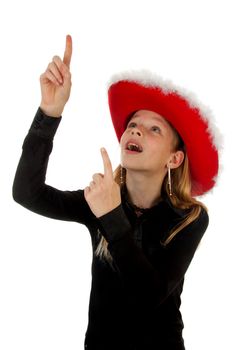 blonde girl with christmas hat over white background is pointing above her head to empty space for your text