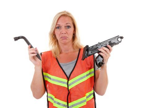 Woman in safety vest holding car breakdown jack and is not knowing what to do with is, over white background