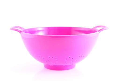 empty pink colander isolated on white background