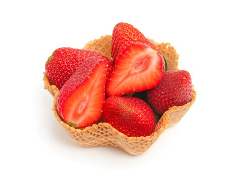 delicious dessert made out of cookie cup filled with fresh strawberry over white background