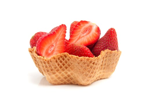 delicious dessert made out of cookie cup filled with fresh strawberry over white background