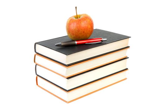 back to school: stack of books with apple and pen on top over white background