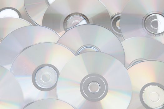 background made out of silver compact discs CDs in closeup