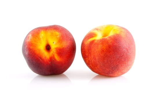 two fresh peaches isolated on white background