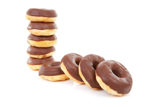delicious chocolate donuts over white background