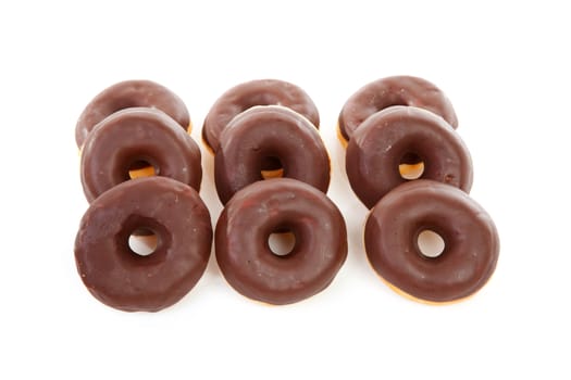 delicious chocolate donuts over white background