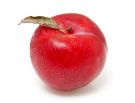 one red plum with leaf  isolated on white background