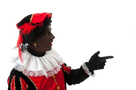 surprised Zwarte piet ( black pete) typical Dutch character part of a traditional event celebrating the birthday of Sinterklaas in december over white background is pointing 