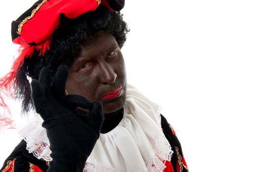 Zwarte piet ( black pete) typical Dutch character part of a traditional event celebrating the birthday of Sinterklaas in december over white background making OK sign