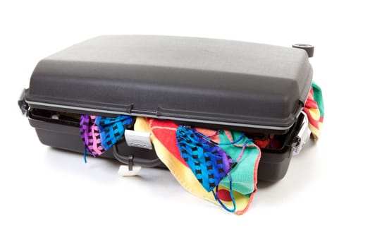 stuffed suitcase for vacation over white background