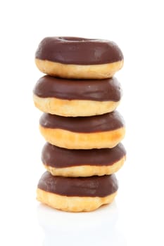 Pile of delicious chocolate donuts over white background