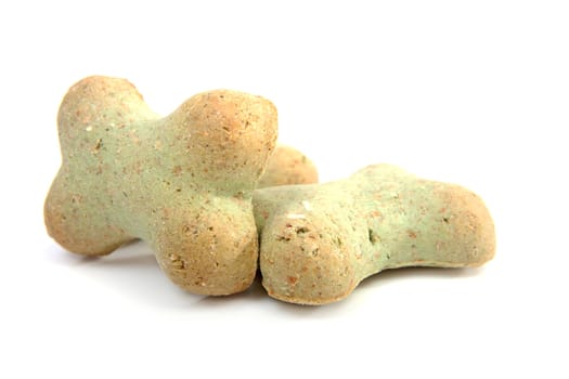 dog cookies in the shape on bone over white background