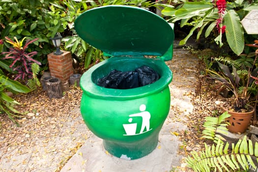 Green bins shaped like a toilet. (toilet bowl)