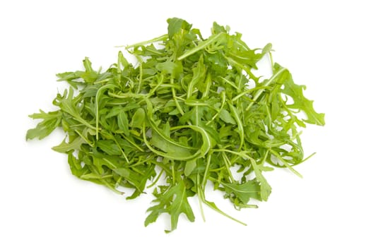 Pile of fresh Ruccola lettuce over white background