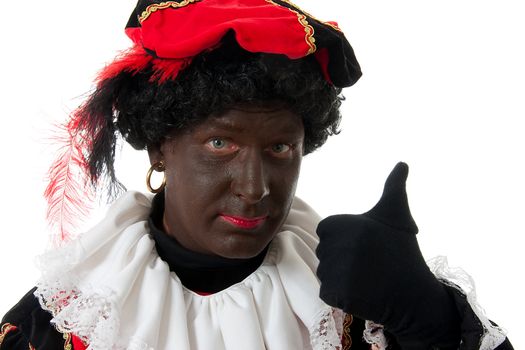 Zwarte piet ( black pete) typical Dutch character part of a traditional event celebrating the birthday of  Sinterklaas in december over white background with thumbs up